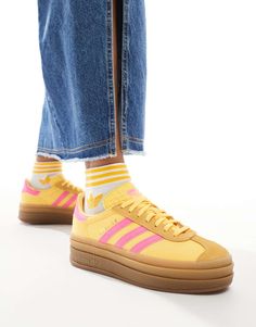 Shoes by adidas Originals A pop of color Low-profile design Lace-up fastening Padded cuff Signature adidas branding Platform sole Textured grip tread Adidas Gazelle Platform, Colourful Sneakers, Colorful Adidas, Colored Sneakers, Gazelle Bold, Yellow Adidas, Suede Cleaner, Bold Shoes, Adidas Branding