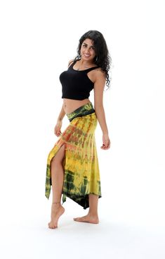 A Yellow Sarong wrap that is bursting with vivid tie dye colors. This comfy pareo wrap is the ideal beach and swim wear fashion that can be used for a variety of purposes. This handmade sarong is carefully crafted with the intricate combination of all natural dyes to create a unique feather tie dye pattern.  Perfect to use as a wrap on those hot days or just to show off your colorful side. A classic tie dye pattern which evokes a strong summer vibe. This skirt wrap is a beautiful tie dye item th Bohemian Multicolor Bottoms For Beach Party, Multicolor Bohemian Bottoms For Beach Party, Bohemian Multicolor Bottoms For Beach Cover-up, Tie Dye Beachwear Bottoms For Beach, Tie Dye Summer Beach Bottoms, Hippie Style Yellow Beach Bottoms, Yellow Hippie Beach Bottoms, Hippie Yellow Bottoms For The Beach, Hippie Yellow Beach Bottoms