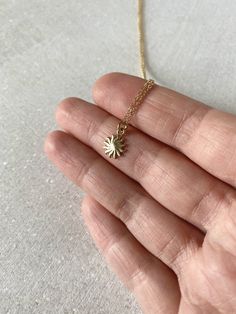 "This solid 14k gold charm is stunning and has a great detail. The slightly curved sun beams and its dome shape add dimension. The pendant measures approximately 8 mm. Now available with the 16 or 18\" dainty solid 14k gold chain. The sun will be suspended on 4 mm open bail (see 1st photo) If you only purchasing the charm, select bail size: 4 mm 14k open jump ring bail and can accommodate chains up to 1.6 mm. 6 mm 14k closed bail that can suit thicker necklaces. Hallmarked 14K 14k sand dollar ch Celestial Yellow Gold Charm Necklaces For Gifts, Everyday Yellow Gold Sun Design Jewelry, Everyday Yellow Gold Jewelry With Sun Design, Elegant Gold Sunburst Jewelry, 14k Gold Star Charm Jewelry Gift, 14k Gold Jewelry With Star Charm Gift, Celestial Recycled Gold Jewelry Gift, 14k Yellow Gold Sun Design Jewelry, 14k Yellow Gold Jewelry With Sun Design