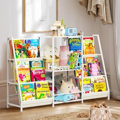 a white book shelf filled with lots of books