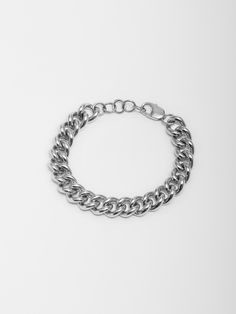 Sterling Silver Solid XL Industrial Curb Chain Bracelet Width: 9.5mm Thickness: 2.5mm Lobster Clasp Adjustable: 1" Extension Total Length: 8" Made in L.A. Globally Sourced Materials Modern Chunky Chain Cuban Link Bracelets, Modern Bracelets With Chunky Cuban Link Chain, Classic Chunky Link Chain Bracelet, Classic Chunky Chain Link Bracelets, White Gold Curb Chain Bracelet, Elegant White Gold Bracelet With Chunky Chain, Classic White Gold Bracelets With Chunky Chain, Classic White Gold Bracelet With Chunky Chain, Classic White Gold Chunky Chain Bracelet