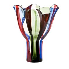 a multicolored glass vase sitting on top of a table