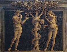 two men standing next to each other in front of a tree with snakes on it