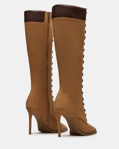 Elevate your style with our UTILITY boots. These boots showcase a sleek, sophisticated look with a knee-high design and pointed toe. The stiletto heel adds height and the lace-up design allows for a snug fit. These boots are perfect for any occasion. 4 inch heel height Size 6 measurements: 13.75 inch shaft circumference, 15 inch shaft height Size 8 measurements: 14.75 inch shaft circumference, 16 inch shaft height Size 10 measurements: 15.75 inch shaft circumference, 17 inch shaft height Leather Trendy Fitted Lace-up Boots With Reinforced Heel, Elegant Lace-up Platform Boots With Reinforced Heel, Elegant Suede Lace-up Boots For Fall, Fall Lace-up Boots With Wide Calf And High Heel, Fitted Brown Lace-up Knee-high Boots, Trendy Fitted Lace-up Boots, Fitted Suede Lace-up Boots With Pointed Toe, Chic Knee-high Lace-up Boots For Fall, Trendy Fitted Leather Lace-up Boots