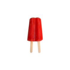 a red popsicle sitting on top of a white table