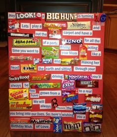 a bulletin board with lots of candy on it in the middle of a kitchen floor