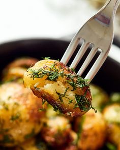 a close up of a fork with food on it