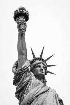 the statue of liberty is shown in black and white