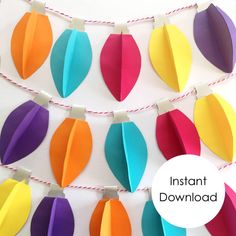 colorful paper leaves hanging on a string with the words instant printables below it