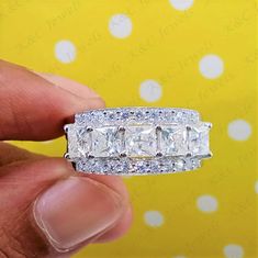 ◆ Center Stone: Princess Cut Moissanite ◆ Side Stone: Simulated Diamond  ◆ Color: DEF ◆ Clarity: VVS1 ◆ Cut: Excellent  ◆ Hardness: 9.25 ◆ Weight: 2.10TCW ◆ Setting: Prong ◆ Metal Weight: 4.9 Gram Approx ◆ Additional Details:  ◆ Ring Size: 4 to 12 USA All Medium Size available ◆ Country of Manufacture: India ◆ Condition: Brand New, Never been used ◆ Free Insured Trackable Shipping. Center Stone 0.75 to 8.00ct Moissanite Stone can be personalized on request.  We also accept bulk orders at wholesale prices. ❤️❤️❤️❤️❤️❤️❤️❤️❤️❤️❤️❤️ ♥You can order this ring in 14k White Gold, Yellow Gold, and Rose Gold ♥You can order this ring with Simulated Diamonds, Natural diamonds, Moissanite, Lab Grown Diamond and anything else in between ♥All customization requests are welcome ❤️❤️❤️❤️❤️❤️❤️❤️❤️❤️❤️❤️ T Emerald Band Ring, Emerald Eternity Band, Asscher Cut Ring, Radiant Cut Rings, Marquise Cut Rings, Mothers Day Rings, Solitaire Bands, Emerald Band, Pear Cut Ring