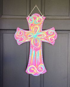 a cross hanging on the front door of a house with an instagram post about it