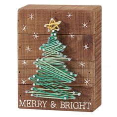 a wooden box with a christmas tree on it