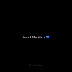 the words never fall for words are shown in blue on a black background with a heart