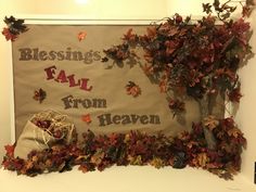 a bulletin board with fall leaves on it