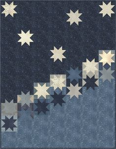 a blue and white quilt with stars on the side, in front of a black background