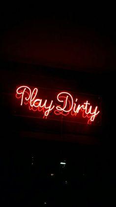 a red neon sign that says play dirty