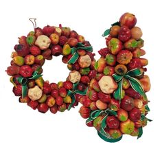 the letter o is made up of apples and other fruits, with leaves on them