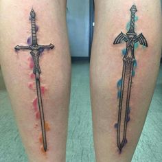 two cross tattoos on both legs with watercolor splashs and swords in the middle