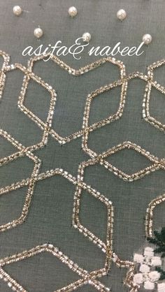 a close up view of some beads on a piece of cloth