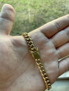 FAST SHIPPING!*TRUSTED SELLER**2300+ TRANSACTIONS* -WONT TURN YOUR WRIST GREEN & HIGH QUALITY! -Premium 14k yellow gold plated miami cuban link bracelet. -7 & 8 inch options. -8mm -Stainless steel base with high quality PVD gold plating that wont turn! -All bracelets are very heavy and feel like real solid gold. -NEW! -Very good quality. Looks even better in person. -For men and women. -Check out my other jewelry listings in my store! -Message me with any questions! Cuban Link Necklace With Lobster Clasp, Luxury Gold Cuban Link Bracelet With Curb Chain, Cuban Link Curb Chain Necklace, Cuban Link Chain Bracelet With Solid Link Construction, Gold Cuban Link Necklace With Solid Links As Gift, Luxury Gold Plated Cuban Link Bracelet With Curb Chain, Luxury Gold-plated Cuban Link Bracelet With Curb Chain, Tarnish Resistant Gold Plated Cuban Link Bracelet, Yellow Gold Cuban Link Bracelet With Solid Construction