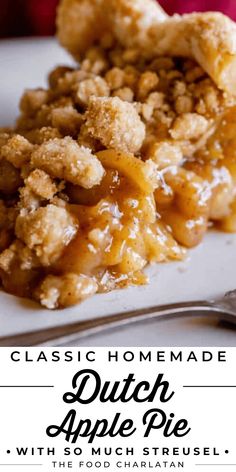 a close up of a slice of apple pie on a white plate with a fork