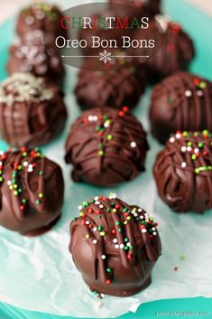 chocolate christmas oreo bons on a plate with sprinkles and candy