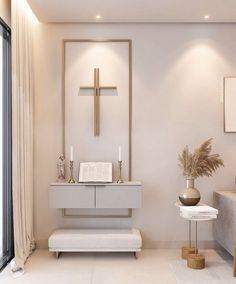 a white room with a cross on the wall