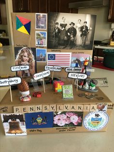 a cardboard box that has pictures and magnets on top of it, with the words pennsylvania written in large letters