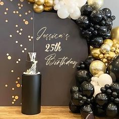 a black and gold birthday party with balloons