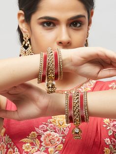 These fancy stone bangles are a perfect accessory for any of your Indian outfits Traditional Indian Jewelry:Slight Color variations are possible due to lighting and photography. If you are interested in purchasing this item and have any additional questions about this item, please feel free to email us at nazranaanj@gmail.com. For faster responses, call us at 732-283-1808 or WhatsApp us at 609-852-9922 Care instructionsKeep Jewelry away from direct heat, water, perfumes, deodorants and other str Kundan Bangle For Party, Festive Jeweled Bracelets For Party, Bangle Jewelry For Navratri Celebration, Festive Bangle With Stone Work For Celebration, Red Festive Bracelets For Navratri, Party Bangle With Gota Work, Festive Celebration Bangle With Stone Work, Festive Fusion Style Bangle For Celebrations, Festive Fusion Bangle For Celebrations