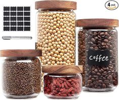 three jars filled with different types of beans and coffee beans next to each other on a white background