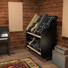 a room with a piano, amp and other musical instruments on the floor in front of wooden paneled walls