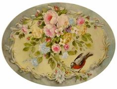 a plate with flowers and birds painted on it