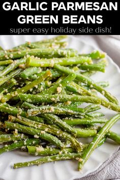 garlic parmesan green beans on a white plate with text overlay that reads garlic parmesan green beans super easy holiday side dish