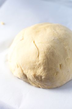 a ball of dough sitting on top of a white cloth