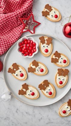 christmas cookies decorated like reindeers on a plate