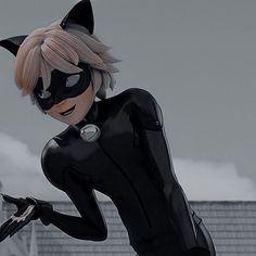 a woman dressed in catwoman costume standing on top of a roof with her hands behind her back