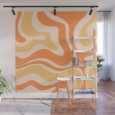 an orange and white wall mural in a living room