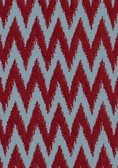 a red and white zigzag pattern is shown on the fabric in this image