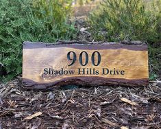 a wooden sign that reads 900 shadow hills drive