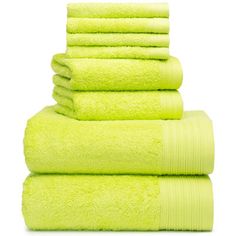 six lime green towels stacked on top of each other in front of a white background