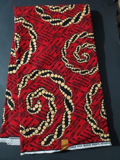 DESCRIPTION Red, Beige and Black African Ankara Fabric. This is high quality African print is 100% cotton and it's 45 inches wide. It is used for making African Clothing, African quilts, & For Home decoration. FYI: Print is Double sided. The listing is for 2yards, 3yards, 6yards and Headwrap Each piece of fabric measures: 70-72in by 45in for 2yards 105-108in by 45in for 3yards 210-216in by 45in for 6yards 70in by 22in for Head wrap If you purchase more than one yard, you will receive one continuous piece. *If you require more than what I have listed, feel free to send me email. CARE INSTRUCTIONS:•DO NOT BLEACH•Hand wash with cold water and mild soap or Dry clean•Press with warm iron on the wrong side only. Color may be different due to your monitor Red Batik Print Cotton Fabric, Red Cotton Fabric With Batik Print, Red Printed Cotton Fabric, Red Fabric With Unique Traditional Pattern, Red Cotton Fabric With Traditional Patterns, Traditional Red Cotton Fabric, Traditional Red Cotton Fabric And Notions, Red Traditional Block Print Fabric, Traditional Red Block Print Fabric