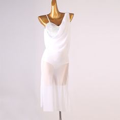 a woman's white dress on a mannequin