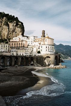 an old town on the shore of a body of water