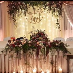 a table with candles and flowers on it