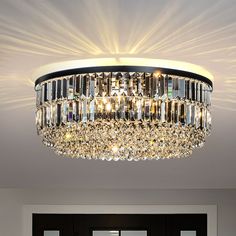 a chandelier hanging from the ceiling in a room