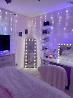 a white bedroom with lights on the walls