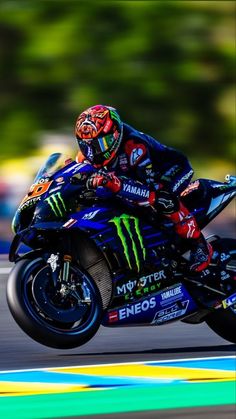 a person riding a motorcycle on a race track