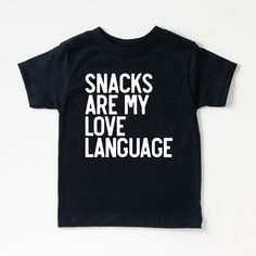 Looking for a cute tee for your kids? We have the perfect Snacks Are My Love Language graphic tee addition to their closet! Also available in toddler tees. Popular Shirts Vinyl, Black Letter Print T-shirt For Playtime, Black T-shirt With Letter Print For Playtime, Cute Black T-shirt With Funny Text, Black Family Matching T-shirt For Playtime, Funny Letter Print T-shirt For Playtime, Casual Tops With Funny Text For Playtime, Toddler Cricut Shirts, Kids Vinyl Shirt Ideas