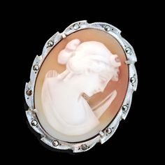 Thank you for visiting the SoChicFinds store - vintage and antique, costume and fine jewelry.  Artemis (Diana) cameo brooch- pendant.  Material: Carved shell, marcasites,   Metal: 800 silver. Stamp: 800 .  Dimensions:  2.4cm x 3.6cm ~  0.94 x 1.41 inches.  Weight of the vintage brooch:  4,88 grams. Vintage Italian jewelry  excellent condition. Marcasite Diana Carved Shell Cameo Brooch, 800 Silver Artemis Cameo Pendant, Bow, Crescent Moon Vintage Italian Jewelry Antique Carved Brooches For Weddings, Antique Cabochon Brooch For Wedding, Antique Cameo Brooches For Wedding, Victorian Brooches For Vintage Events, Vintage Carved Collectible Brooches, Ornate Cameo Brooch, Antique Cameo Brooch Collectible, Antique Cameo Brooches Collectible, Ornate Cameo Brooches For Collectors